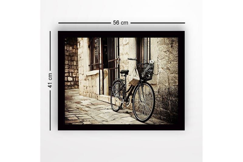 Innrammet lerret i tre - 41x56 cm - Sykkel lent mot en gammel steinmur - Svart / Beige / Grå - Interiør - Maleri & posters - Lerretsbilder