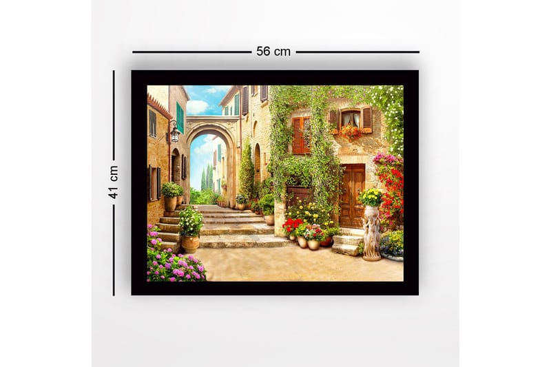 Innrammet lerretsbilde i tre - 41x56 cm - Sjarmerende smug med blomsterprydede hus og en bue i bakgrunnen - Grønn / Gul / Rosa - Interiør - Maleri & posters - Lerretsbilder