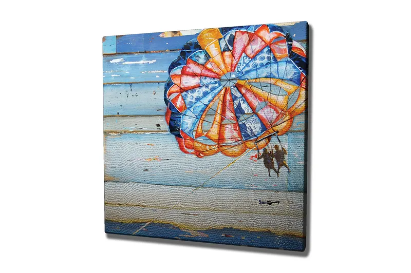 Lerretsbilde 45x45 cm - Fargerik fallskjerm med to personer som svever over havet - Blå / Oransje / Rød - Interiør - Maleri & posters - Lerretsbilder