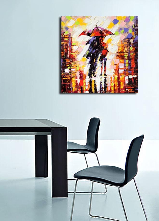 Lerretsbilde 45x45 cm - Silhuett av en person med paraply i et fargerikt bymiljø - Rød / Oransje / Svart - Interiør - Maleri & posters - Lerretsbilder