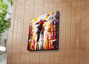 Lerretsbilde 45x45 cm - Silhuett av en person med paraply i et fargerikt bymiljø - Rød / Oransje / Svart - Interiør - Maleri & posters - Lerretsbilder