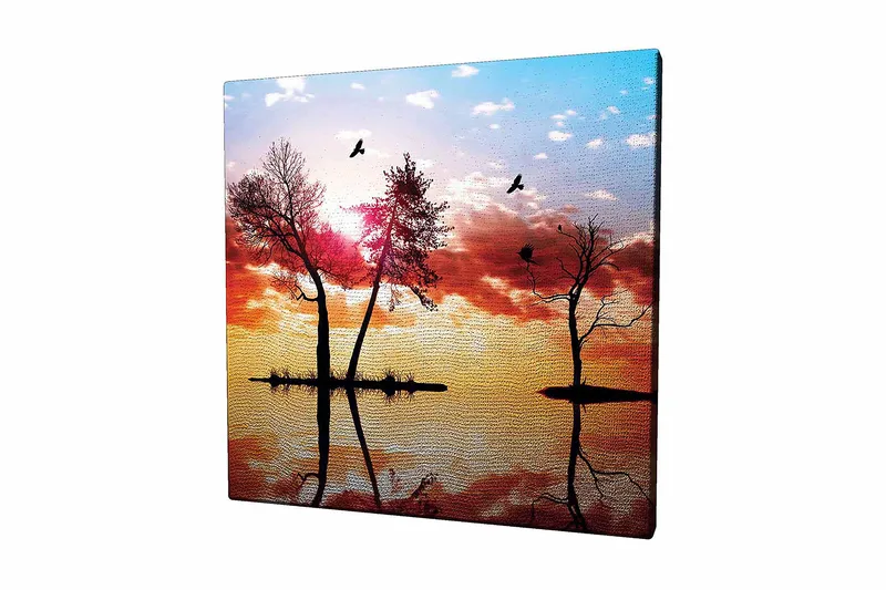 Lerretsbilde 45x45 cm - Silhuetter av trær ved solnedgang med refleksjoner i vannet, Oransje / Rosa / Blå