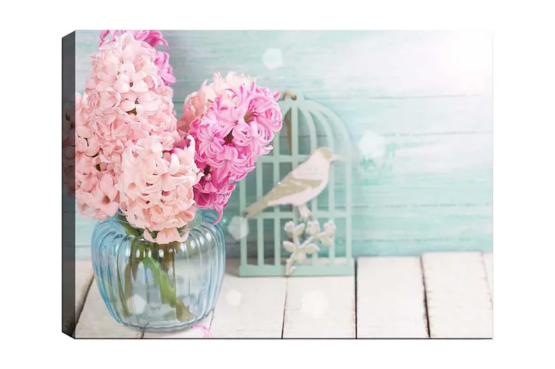 Lerretsbilde 70x100 cm - Bukett med rosa hyasinter i en glassvase, Rosa / Lys blå / Grønn