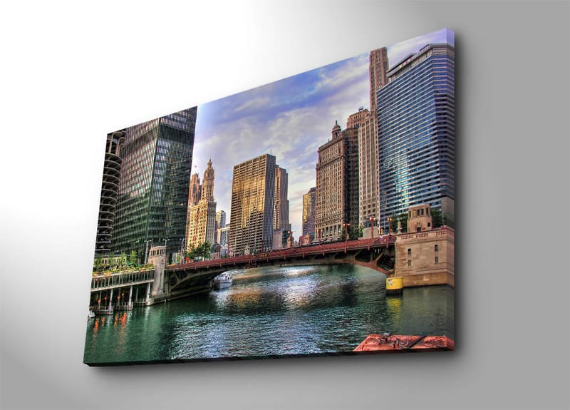 Lerretsbilde 70x100 cm - Bysilhuett med moderne skyskrapere og en bro over en vannvei, Blå / Grønn / Beige