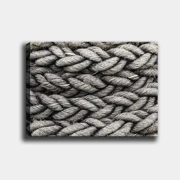 Lerretsbilde 70x100 cm - Detaljert nærbilde av flettet tau med en tekstur som fremhever strukturen og materialiteten - Grå / Svart - Interiør - Maleri & posters - Lerretsbilder
