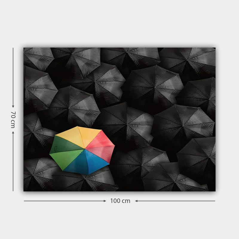 Lerretsbilde 70x100 cm - Ensom fargerik paraply blant en mengde svarte paraplyer - Svart / Gul / Rød - Interiør - Maleri & posters - Lerretsbilder