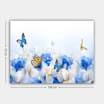 Lerretsbilde 70x100 cm - Fargerik komposisjon av sommerfugler som svever over hvite og blå blomster - Blå / Hvit / Gul - Interiør - Maleri & posters - Lerretsbilder