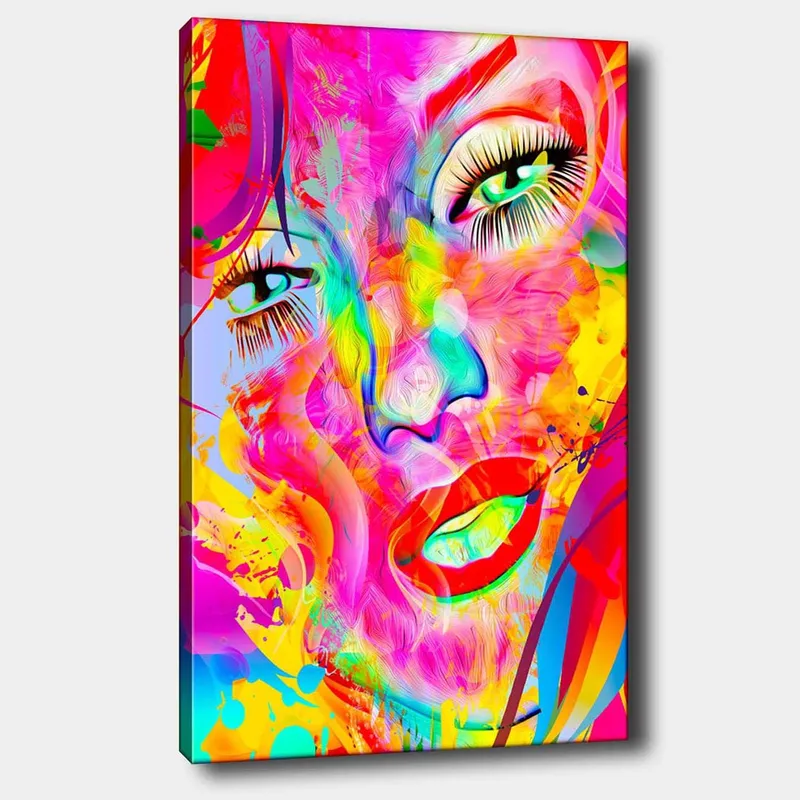 Lerretsbilde 70x100 cm - Fargerik og abstrakt portrett av en kvinne med uttrykksfulle øyne og lepper, Rosa / Gul / Grønn