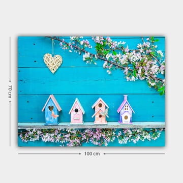 Lerretsbilde 70x100 cm - Fargerike fuglehus på blå bakgrunn med blomster som dekorasjon - Blå / Rosa / Hvit - Interiør - Maleri & posters - Lerretsbilder