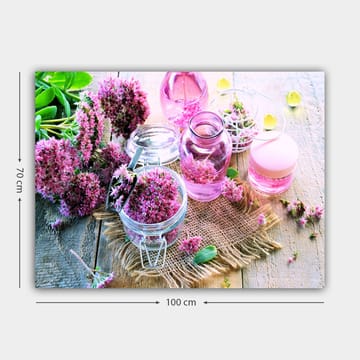 Lerretsbilde 70x100 cm - Fredelig komposisjon med rosa blomster og glassbeholdere som skaper en harmonisk atmosfære - Rosa / Grønn / Klar - Interiør - Maleri & posters - Lerretsbilder