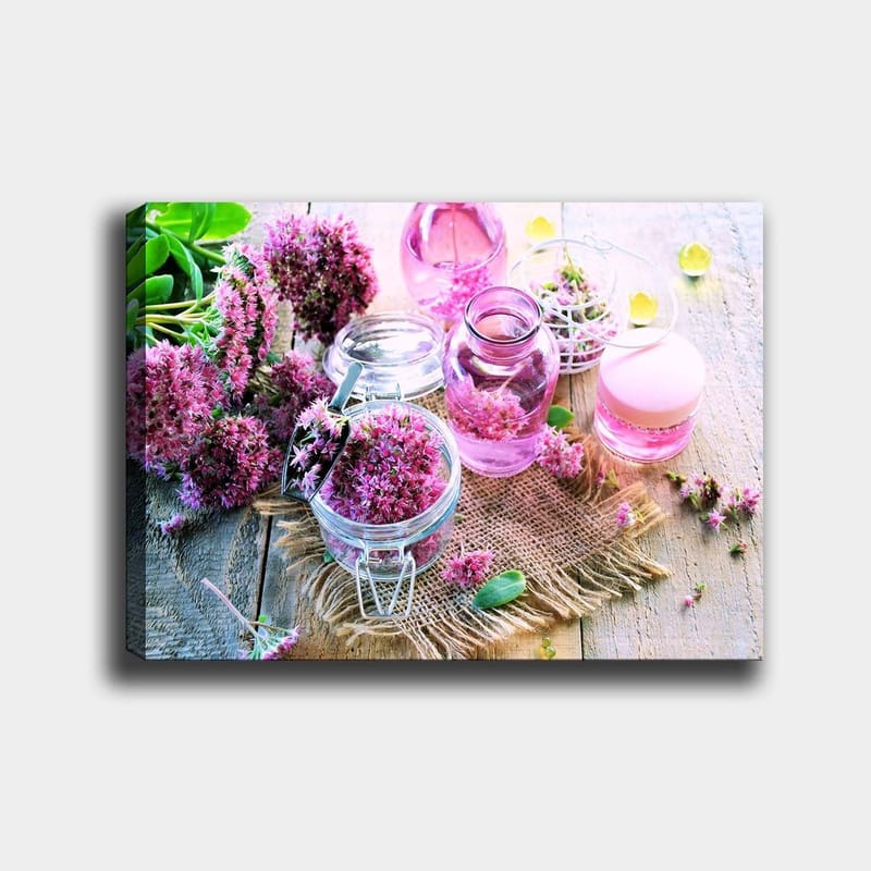 Lerretsbilde 70x100 cm - Fredelig komposisjon med rosa blomster og glassbeholdere som skaper en harmonisk atmosfære, Rosa / Grønn / Klar