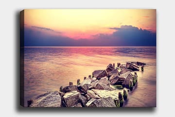 Lerretsbilde 70x100 cm - Fredelig utsikt over en steinete kystlinje ved solnedgang - Grå / Lys blå / Rosa - Interiør - Maleri & posters - Lerretsbilder