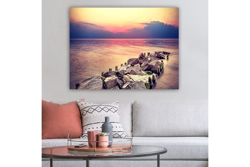 Lerretsbilde 70x100 cm - Fredelig utsikt over en steinete kystlinje ved solnedgang - Grå / Lys blå / Rosa - Interiør - Maleri & posters - Lerretsbilder