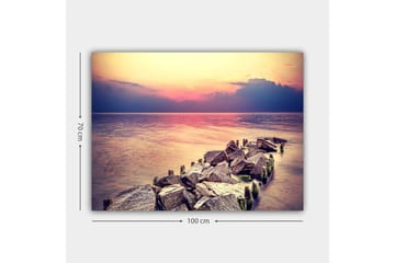 Lerretsbilde 70x100 cm - Fredelig utsikt over en steinete kystlinje ved solnedgang - Grå / Lys blå / Rosa - Interiør - Maleri & posters - Lerretsbilder