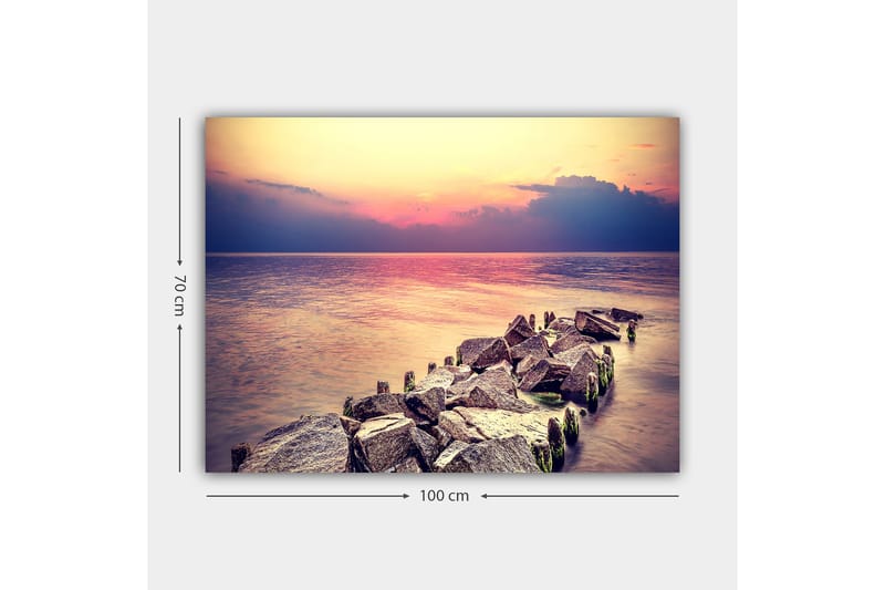 Lerretsbilde 70x100 cm - Fredelig utsikt over en steinete kystlinje ved solnedgang - Grå / Lys blå / Rosa - Interiør - Maleri & posters - Lerretsbilder