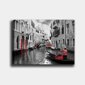 Lerretsbilde 70x100 cm - Gondolier som navigerer gjennom en venetiansk kanal med fargerike detaljer i et svart-hvitt miljø - Rød / Grønn / Svart - Interiør - Maleri & posters - Lerretsbilder