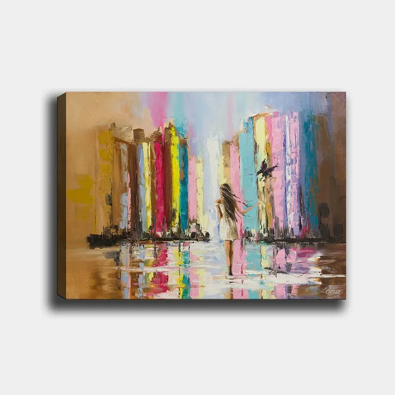 Lerretsbilde 70x100 cm - Kvinne i hvit kjole går gjennom en fargerik by med høye bygninger i bakgrunnen, Rosa / Gul / Blå