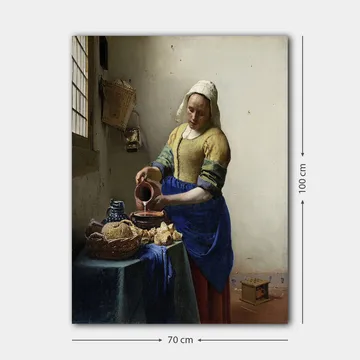 Lerretsbilde 70x100 cm - Kvinne som heller melk i en bolle på et lyst kjøkken - Blå / Gul / Brun - Interiør - Maleri & posters - Lerretsbilder