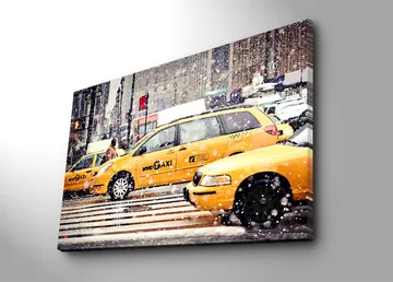 Lerretsbilde 70x100 cm - Livlig bybilde med gule drosjer som kjører gjennom snøfall i New York City - Gul / Svart - Interiør - Maleri & posters - Lerretsbilder
