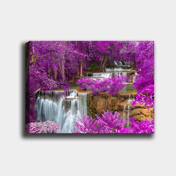 Lerretsbilde 70x100 cm - Magisk fossefall omgitt av lilla blomster og grøntområder - Lilla / Grønn / Hvit - Interiør - Maleri & posters - Lerretsbilder