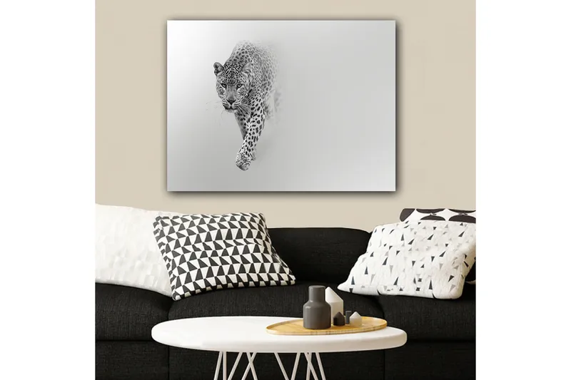 Lerretsbilde 70x100 cm - Majestetisk leopard som beveger seg fremover i en stilig og minimalistisk komposisjon - Svart / Grå - Interiør - Maleri & posters - Lerretsbilder