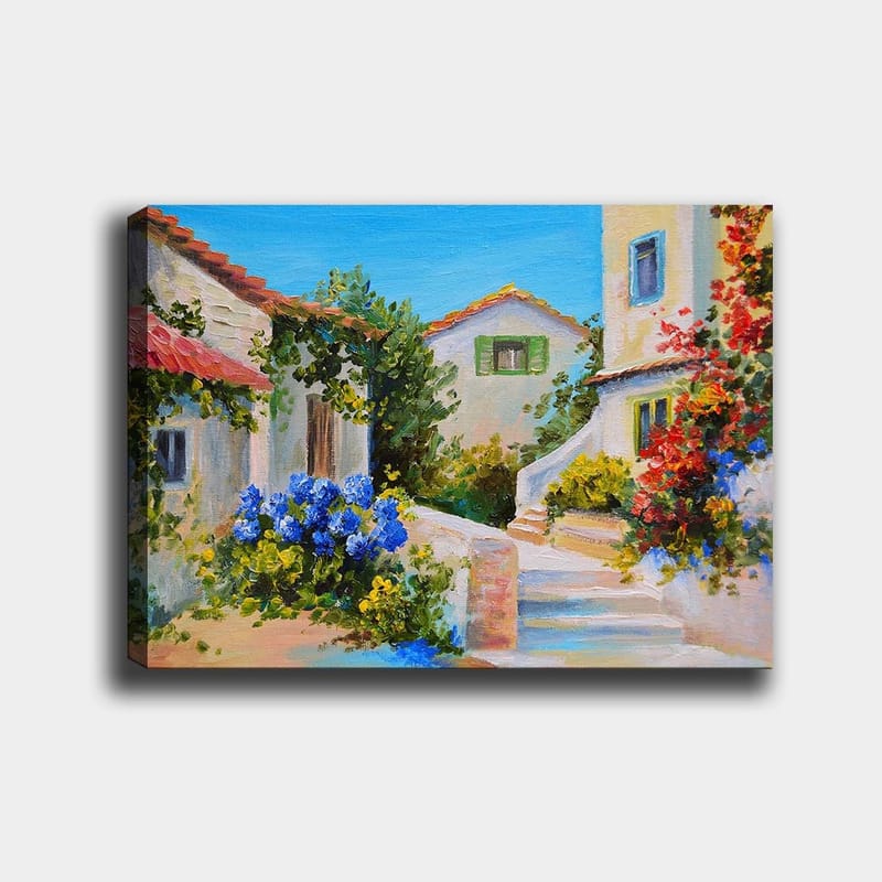 Lerretsbilde 70x100 cm - Malerisk landsbyscene med fargerike hus og blomstrende planter, Blå / Grønn / Gul