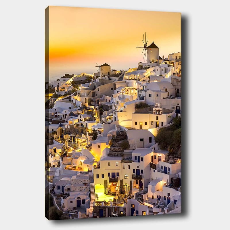 Lerretsbilde 70x100 cm - Malerisk utsikt over Santorini med hvite hus og en vindmølle i solnedgangens lys, Hvit / Gul / Oransje
