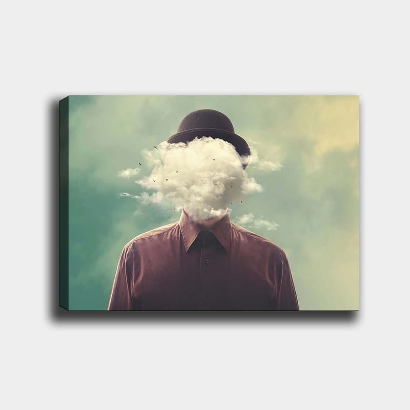 Lerretsbilde 70x100 cm - Mann med hatt hvis ansikt er skjult av en skyformasjon, Mørk brun / Lys grå / Grønn