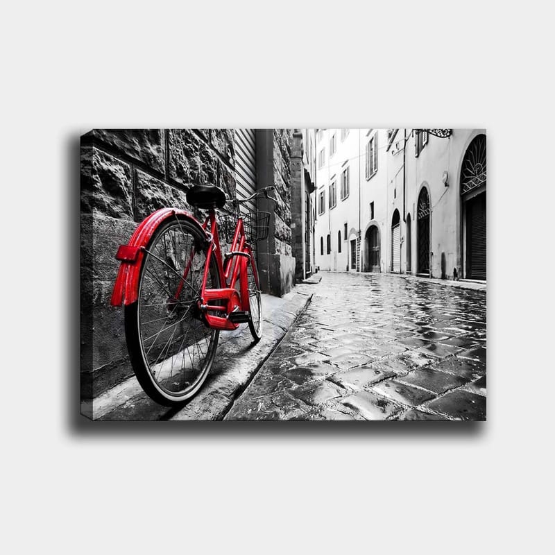 Lerretsbilde 70x100 cm - Rød sykkel lent mot en vegg i et svart-hvitt bymiljø, Rød / Svart / Grå