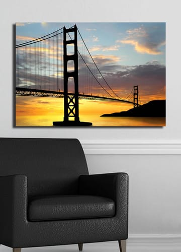 Lerretsbilde 70x100 cm - Silhuett av en bro mot en fargerik solnedgang - Oransje / Svart / Blå - Interiør - Maleri & posters - Lerretsbilder