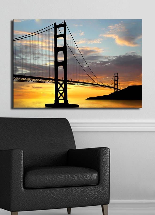 Lerretsbilde 70x100 cm - Silhuett av en bro mot en fargerik solnedgang - Oransje / Svart / Blå - Interiør - Maleri & posters - Lerretsbilder