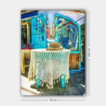 Lerretsbilde 70x100 cm - Stilig og fargerik interiørdetalj med en hatt på et bord, omgitt av smykker og klær - Blå / Hvit / Beige - Interiør - Maleri & posters - Lerretsbilder