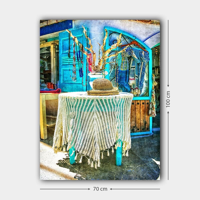 Lerretsbilde 70x100 cm - Stilig og fargerik interiørdetalj med en hatt på et bord, omgitt av smykker og klær - Blå / Hvit / Beige - Interiør - Maleri & posters - Lerretsbilder