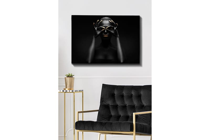 Lerretsbilde 70x100 cm - Stilisert portrettbilde av en kvinne med svarte hender som danner et par øyne, med gylne detaljer på lepper og fingertupper - Svart / Gull - Interiør - Maleri & posters - Lerretsbilder