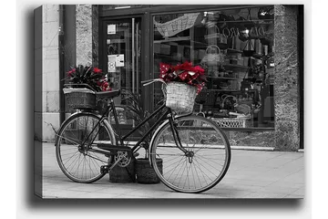 Lerretsbilde 70x100 cm - Svart sykkel med blomster i kurver på en gate - Rød / Svart / Grå - Interiør - Maleri & posters - Lerretsbilder