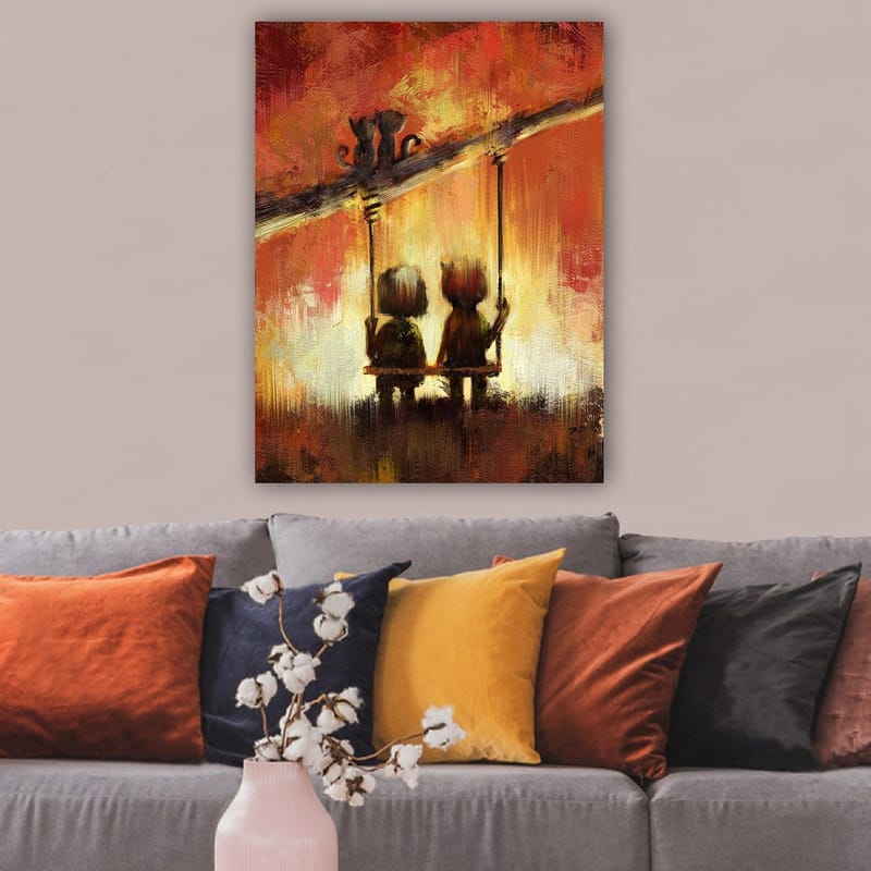 Lerretsbilde 70x100 cm - To figurer som sitter på en huske under en varm, fargerik himmel - Rød / Oransje / Gul - Interiør - Maleri & posters - Lerretsbilder
