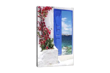 Lerretsbilde 70x100 cm - Vakker blå dør omgitt av blomster i rødt som fører ut til havutsikt - Blå / Rød / Grønn - Interiør - Maleri & posters - Lerretsbilder