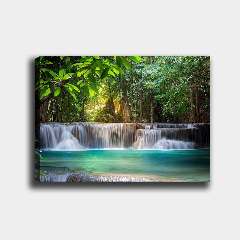 Lerretsbilde 70x100 cm - Vakker foss omgitt av frodig grøntområde - Grønn / Turkis / Brun - Interiør - Maleri & posters - Lerretsbilder