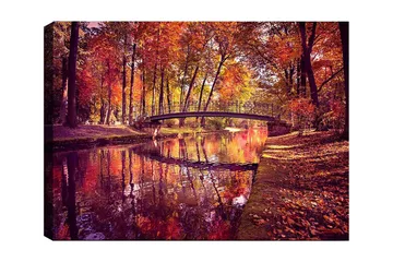 Lerretsbilde 70x100 cm - Vakker høstscene med en bro som spenner over en speilblank vannoverflate omgitt av fargerike trær - Oransje / Rød / Gul - Interiør - Maleri & posters - Lerretsbilder