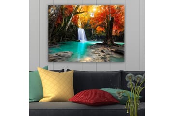 Lerretsbilde 70x100 cm - Vakker høstscene med en foss omgitt av fargerike trær i oransje og røde nyanser - Turkis / Oransje / Rød - Interiør - Maleri & posters - Lerretsbilder