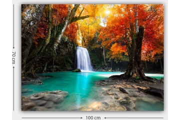 Lerretsbilde 70x100 cm - Vakker høstscene med en foss omgitt av fargerike trær i oransje og røde nyanser - Turkis / Oransje / Rød - Interiør - Maleri & posters - Lerretsbilder
