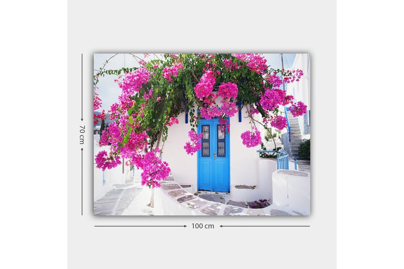 Lerretsbilde 70x100 cm - Vakker hvit bygning med en blå dør omgitt av lilla blomster - Lilla / Blå / Grønn - Interiør - Maleri & posters - Lerretsbilder
