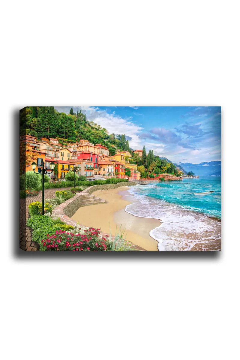 Lerretsbilde 70x100 cm - Vakker kystlinje med fargerike hus som klatrer opp en frodig ås ved en strand, Blå / Grønn / Gul
