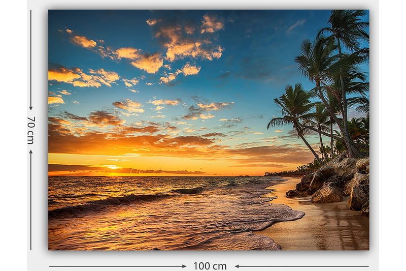 Lerretsbilde 70x100 cm - Vakker solnedgang på en strand med palmer og myke bølger som ruller nedover sanden - Oransje / Blå / Beige - Interiør - Maleri & posters - Lerretsbilder