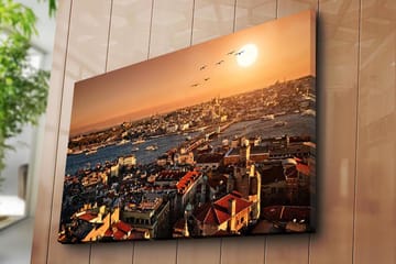 Lerretsbilde 70x100 cm - Vakker utsikt over Istanbul ved solnedgang, med hustak og båter på vannet - Oransje / Rød / Blå - Interiør - Maleri & posters - Lerretsbilder