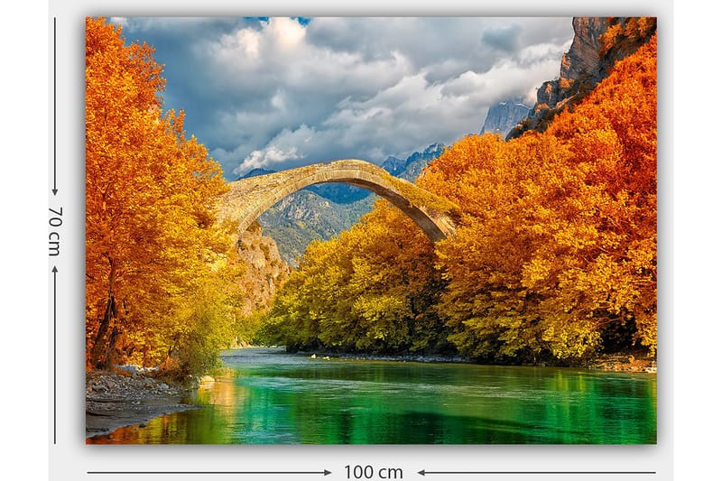 Lerretsbilde 70x100 cm - Vakkert høstlandskap med en gammel steinbro som strekker seg over en glitrende elv omgitt av fargerike trær - Oransje / Grønn / Blå - Interiør - Maleri & posters - Lerretsbilder