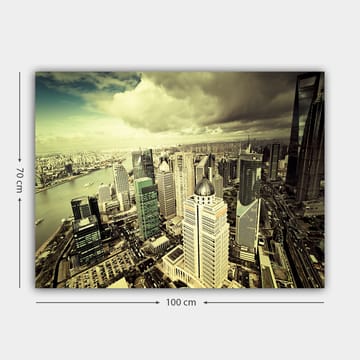 Lerretsbilde 70x100 cm - Panoramautsikt over en moderne by med høye skyskrapere og en elv som renner gjennom landskapet - Grønn / Grå / Beige - Interiør - Maleri & posters - Lerretsbilder