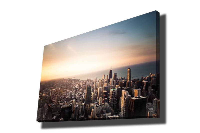 Lerretsbilde 70x100 cm - Panoramautsikt over en by med høye skyskrapere og en solnedgang som skaper en dramatisk atmosfære, Blå / Oransje / Grå