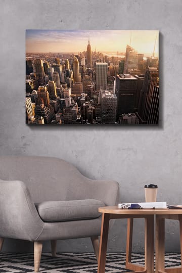 Lerretsbilde 70x100 cm - Panoramautsikt over en by med skyskrapere og den ikoniske Empire State Building ved solnedgang - Gull / Grå / Blå - Interiør - Maleri & posters - Lerretsbilder
