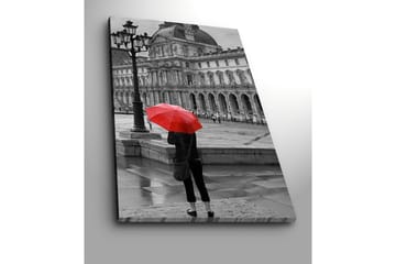 Lerretsbilde 70x100 cm - Person som st år med en rød paraply i et regnfullt bymiljø foran en historisk bygning - Rød / Svart - Interiør - Maleri & posters - Lerretsbilder